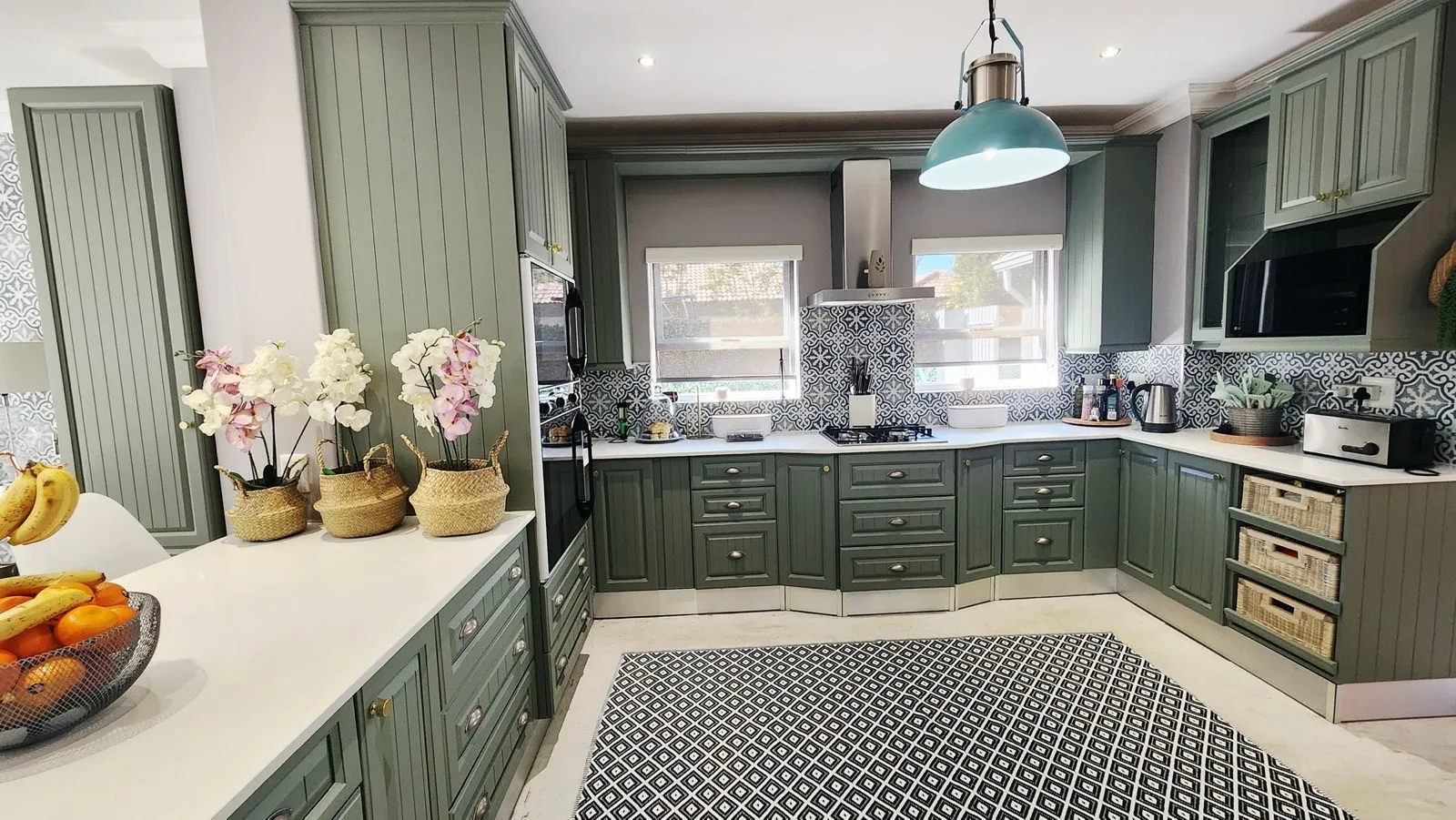 Sage, with a little character: the finished kitchen.