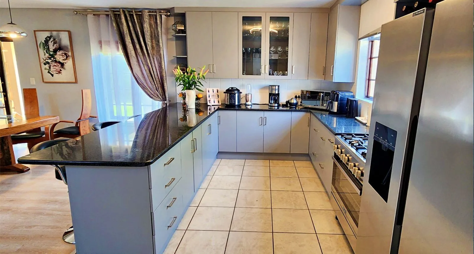 From timber to soft blue: the finished kitchen.