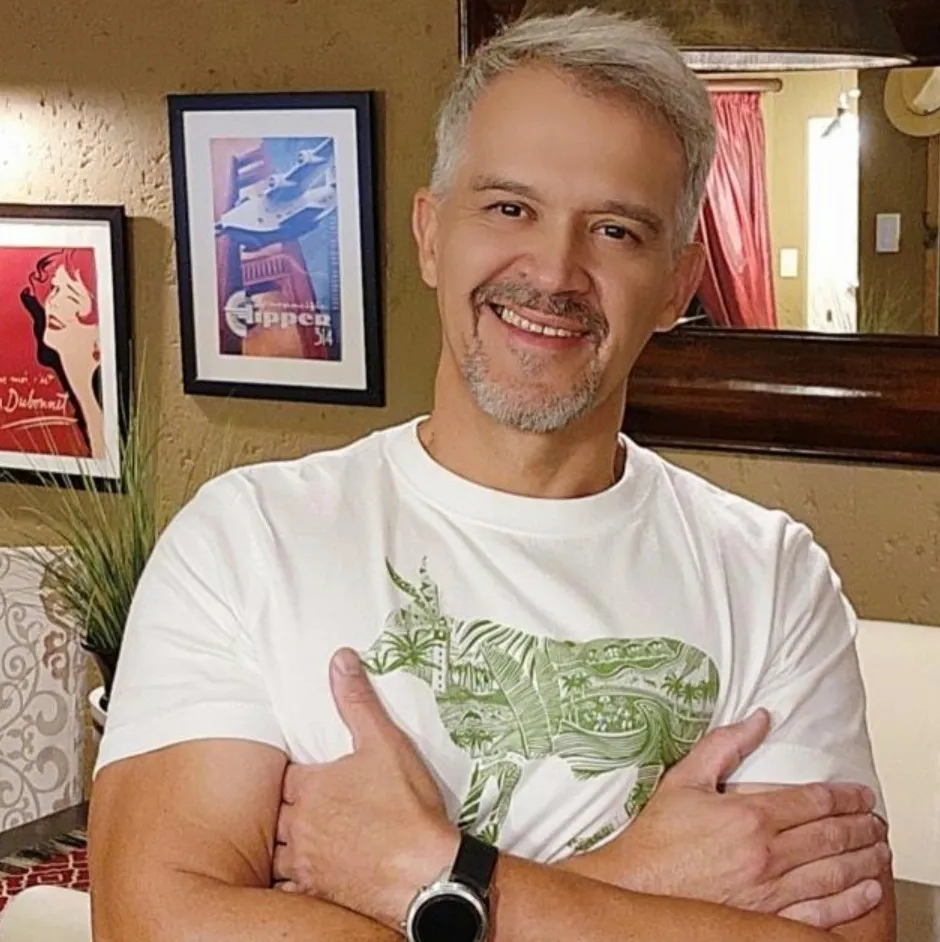 Morné Nagel, founder of PaintProjex, smiling with his arms folded.